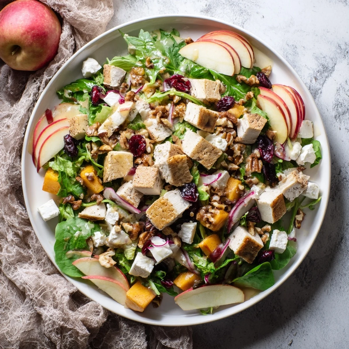 Hearty Chicken and Apple Winter Salad, boasting juicy apples and tender chicken, ready to enjoy.
