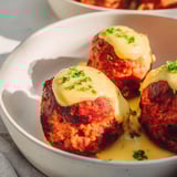 Warm, oven-baked German meatballs, coated in a rich mustard sauce, perfect for dinner tonight.
