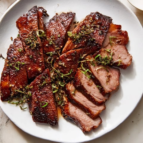 A glistening, golden-brown Festive Roast Goose with Asian Five-Spice, ready to carve.