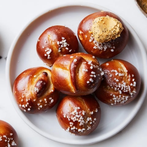Golden-brown Christmas Market pretzel bites fresh from the oven, served with flavorful zaatar butter.
