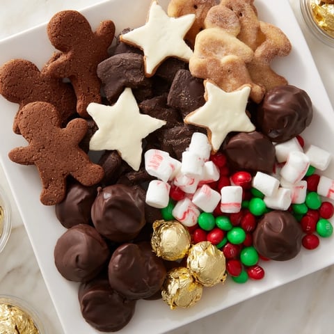 A candy board overflowing with various candies, a festive Santas Sack Candy Avalanche, ready to eat.