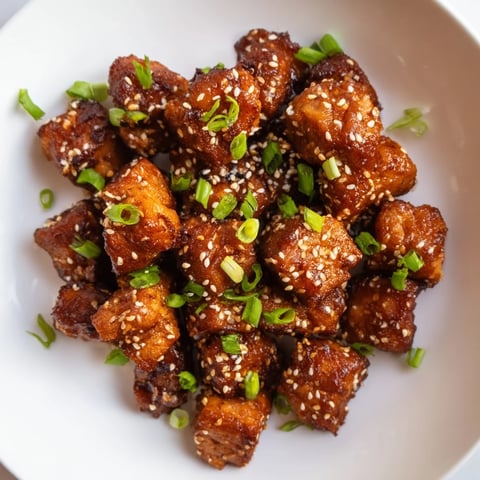 Crispy golden air fryer turkey or chicken bites glistening with honey, ready for your party.