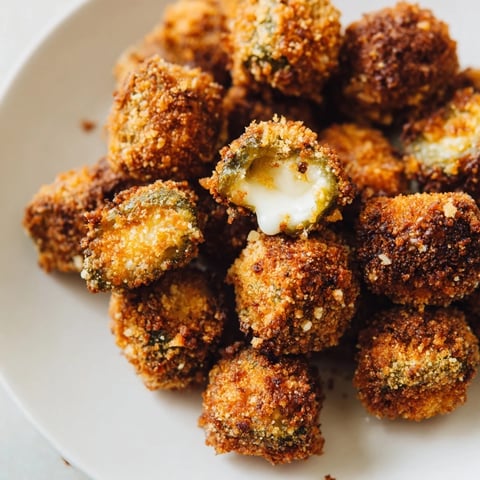 Golden-brown Crispy Chickle Bites, a delightful appetizer with melted cheese and crispy coating.