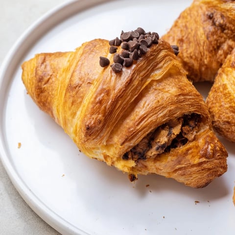 Chocolate Cookie Croissants bursting with melty chocolate, a golden-brown pastry delight.