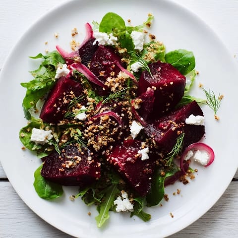 Golden toasted rye breadcrumbs topping a vibrant warm beet and caraway seed salad.
