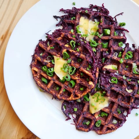 Savory Crispy Red Cabbage Waffles, piled high and ready to be served for a delicious brunch.